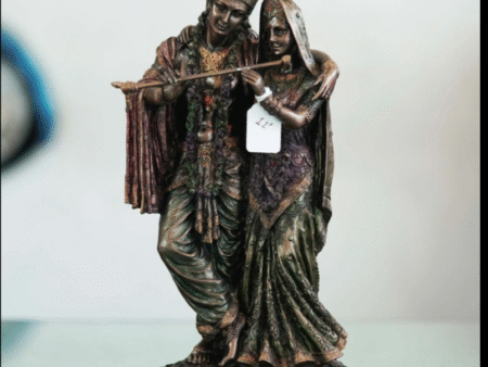 bronze statue depicting Radha and Krishna murti